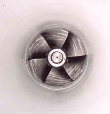 Propeller turbine runner mounted in housing. The pitch diameter is 500 mm, producing 200 kW at 1200 RPM.